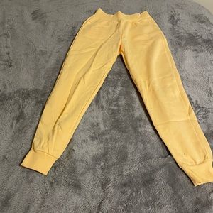 orangish yellow sweatpants